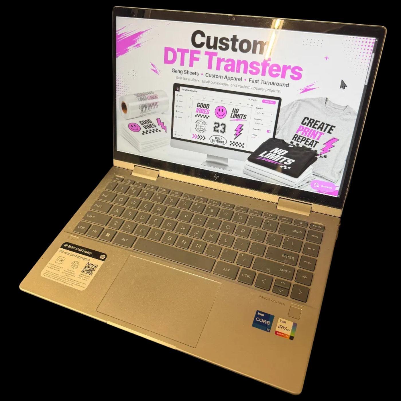 Laptop screen displaying a Custom DTF Transfers promotional graphic with gang sheet builder preview