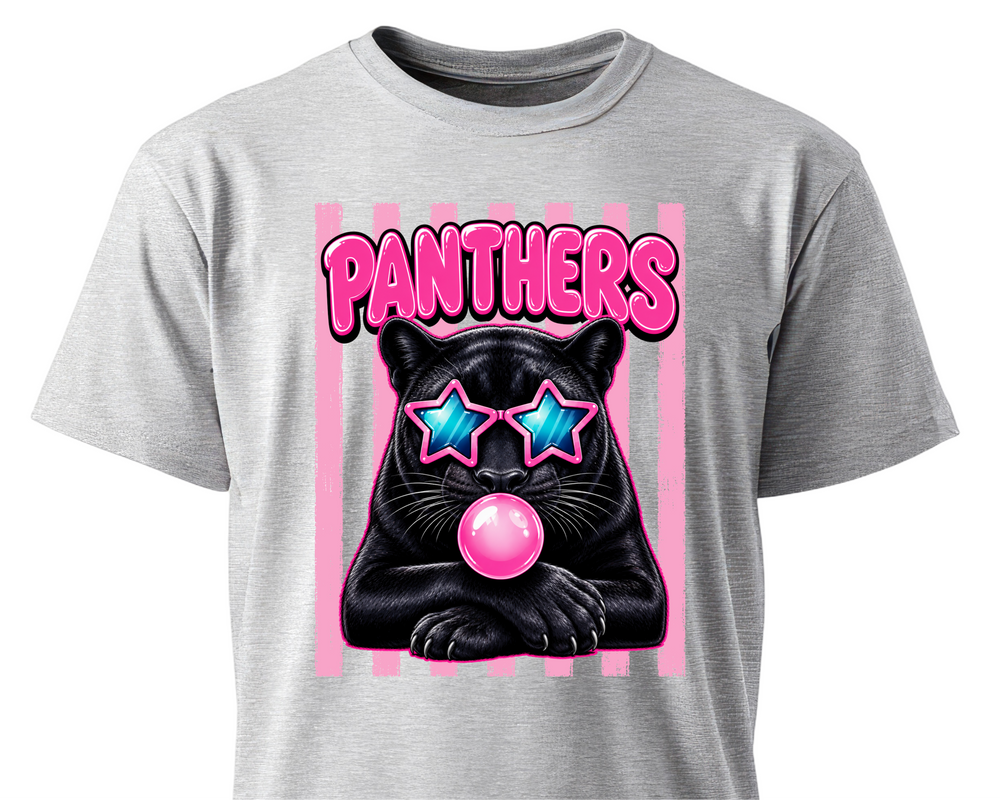 A heather gray short-sleeve t-shirt featuring a graphic print of a black panther wearing pink star-shaped sunglasses and blowing a pink bubblegum bubble, with the word 'PANTHERS' in pink above it.